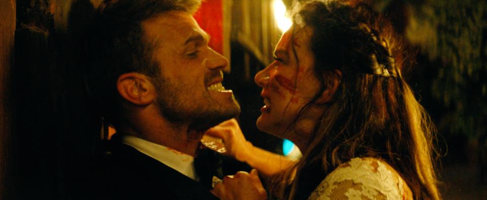 Natalie Burn plays a runaway bride who fights to survive when she's attacked by her fiance's best man (Cam Gigandet) and the rest of the groomsmen in the action film "Til Death Do Us Part."