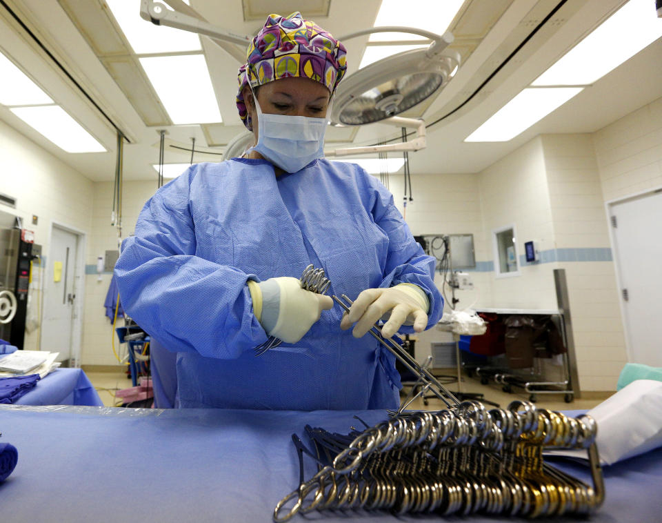 Surgical Tech Melissa Ellis prepares an OR room in the University of Mississippi Medical Center in Jackson, Mississippi October 4, 2013. Mississippi is one of at least 20 states that has decided not to expand Medicaid under the Affordable Care Act, better known as 