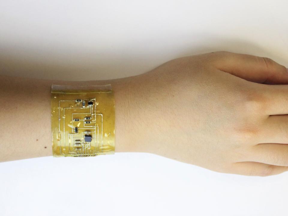 A person wears an ‘electronic skin' device on the wrist. (Chuanqian Shi)
