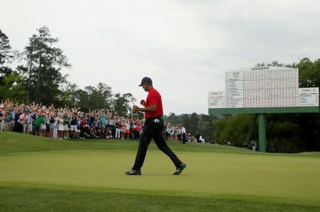 Golf - Masters - Augusta National Golf Club - Augusta, Georgia, U.S. - April 14, 2019 - Tiger Woods of the U.S. celebrates on the 18th hole after winning the 2019 Masters. REUTERS/Brian Snyder