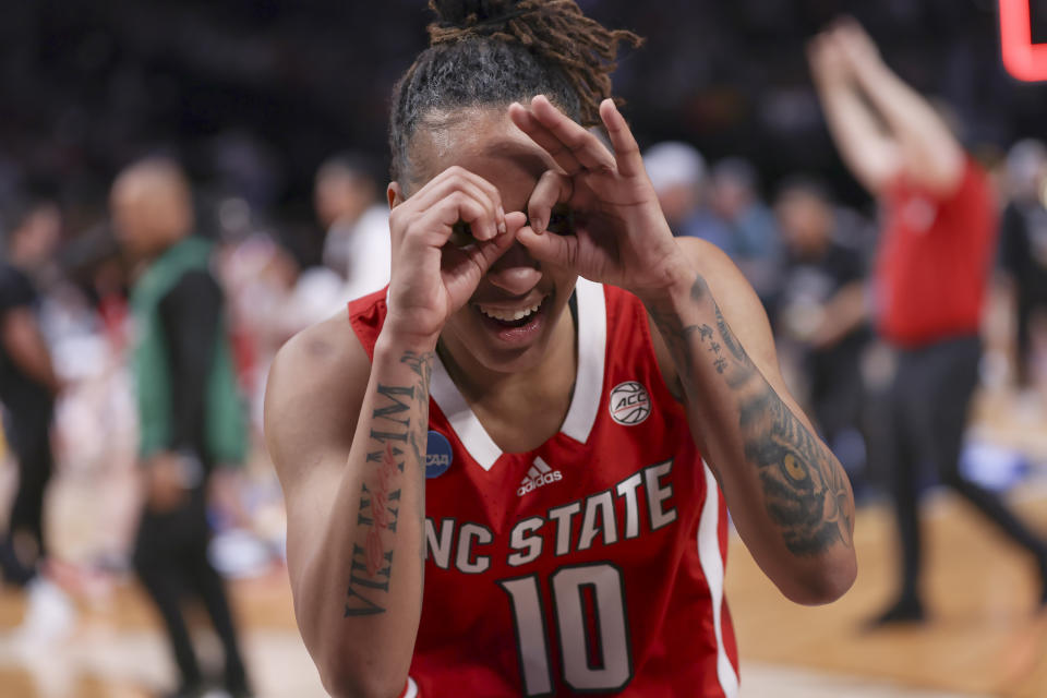 North Carolina State guard Aziaha James (10) celebrates after a Sweet 16 college basketball game against Stanford in the women's NCAA Tournament, Friday, March 29, 2024, in Portland, Ore. North Carolina State won 77-67. (AP Photo/Howard Lao)