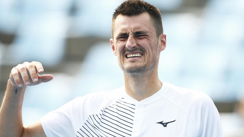 Bernard Tomic, pictured here feeling the heat and grimacing at the Australian Open.