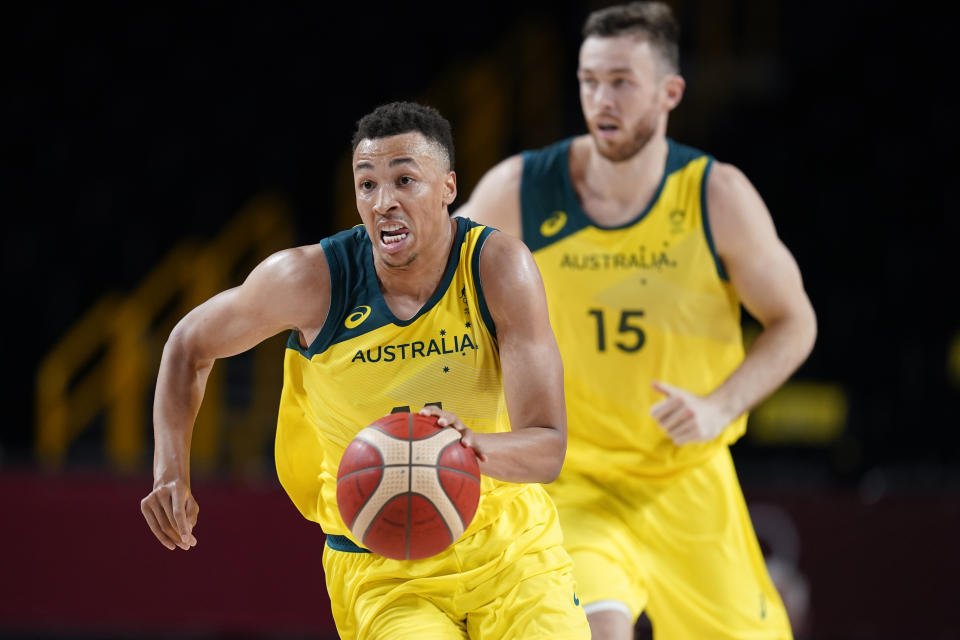 Australia's Dante Exum drives up court during a men's basketball preliminary round game against Nigeria at the 2020 Summer Olympics, Sunday, July 25, 2021, in Saitama, Japan. (AP Photo/Charlie Neibergall)