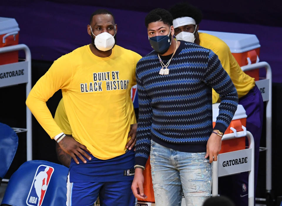 LeBron James, left, along with injured teammate Anthony Davis, right, of the Los Angeles Lakers against the Brooklyn Nets in the fourth quarter of a NBA basketball game at the Staples Center in Los Angeles on Thursday, February 18, 2021. (Photo by Keith Birmingham/MediaNews Group/Pasadena Star-News via Getty Images)