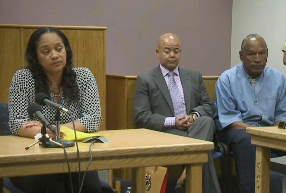 <p>Arnelle Simpson, left, testifies for her father, former NFL football star O.J. Simpson, far right, as attorney, Malcolm LaVergne, center, listens during O.J. Simpson’s hearing at the Lovelock Correctional Center in Lovelock, Nev., on Thursday, July 20, 2017. (Photo: KOLO-TV via AP, POOL) </p>