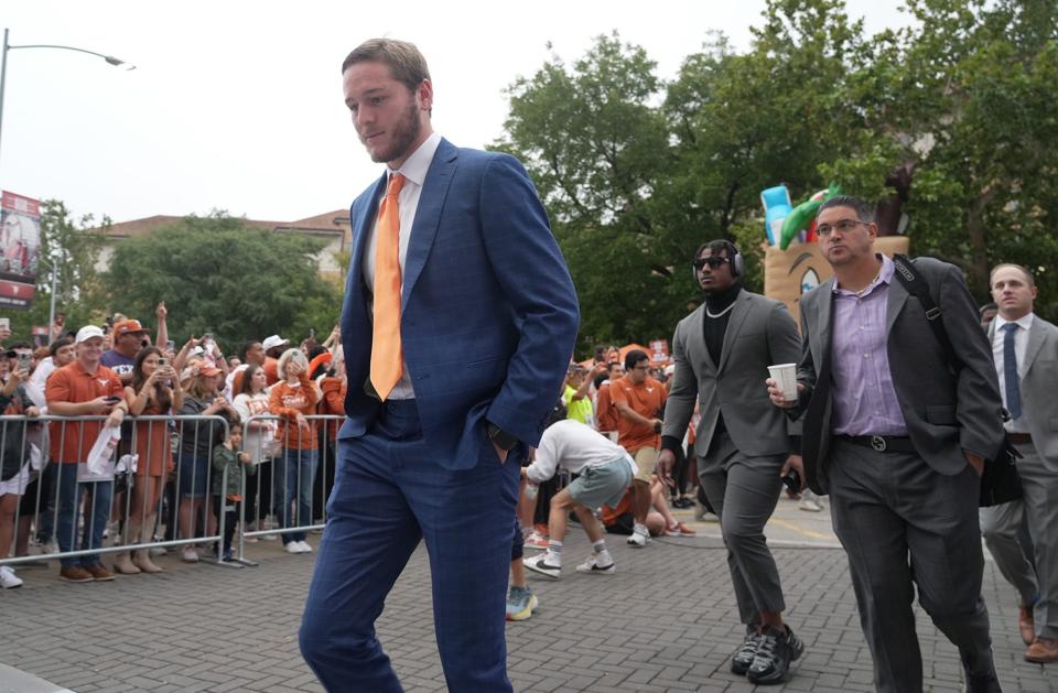 Texas Longhorns quarterback Quinn Ewers makes his way into the stadium to play against Kansas State Wildcats of an NCAA college football game, Saturday, November. 4, 2023, in Austin, Texas.