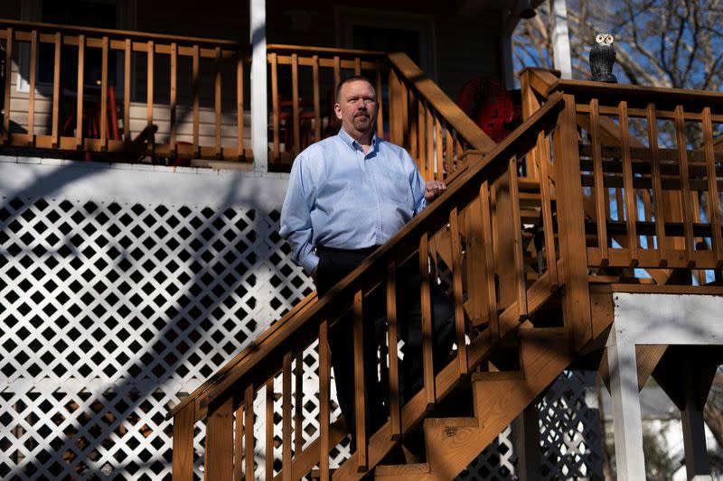 Randall Buchanan poses for a portrait at his home in Douglasville