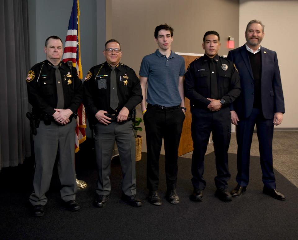 The Exchange Club of Canton-Stark County honored law enforcement officials and its citizen of the year Wednesday at the annual Crime Prevention Breakfast held in Plain Township. The honorees are, from left, Community Police Officer of the Year Deputy Fred Leight, Stark County Deputy of the Year Jeffrey McCollister, Crime Prevention Citizen of the Year Levi Grimm and Canton City Police Officer of the Year Detective Michael Herrera. They are shown with Ohio Attorney General David Yost who was the keynote speaker.