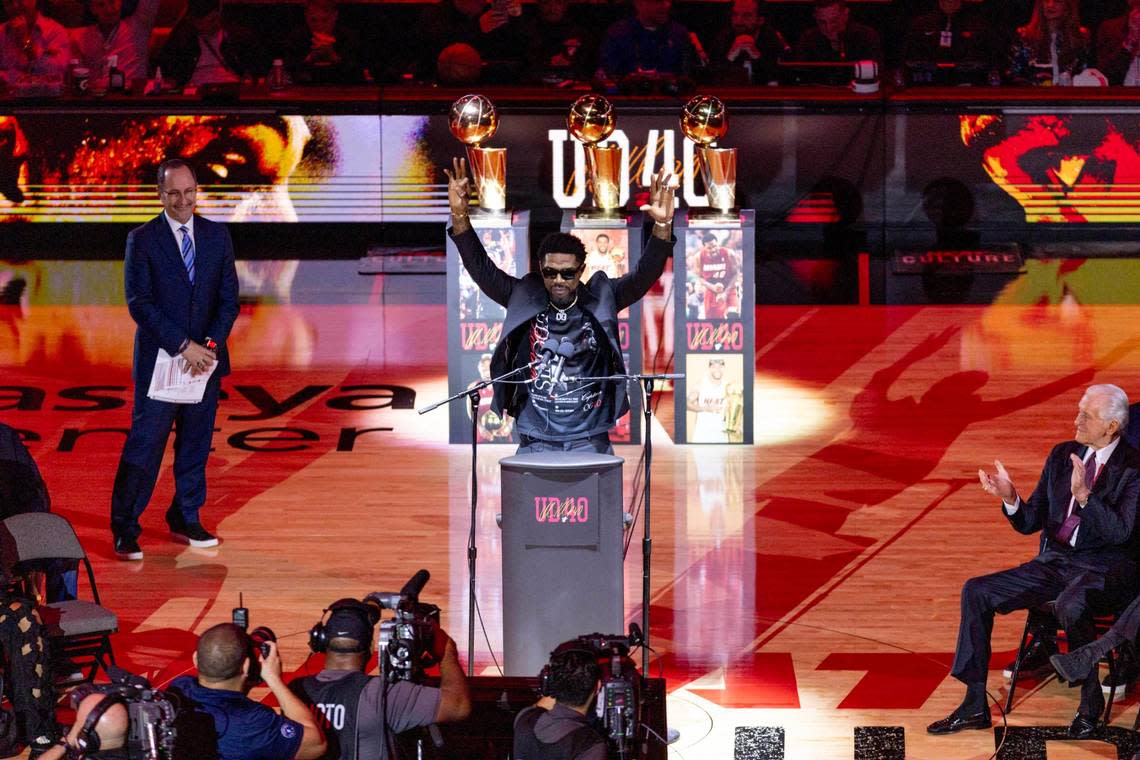 Former Miami Heat forward Udonis Haslem holds up the ’305’ hand sign at the end of is speech during a halftime jersey retirement ceremony at Kaseya Center in Miami, Florida, on Friday, January 19, 2024.