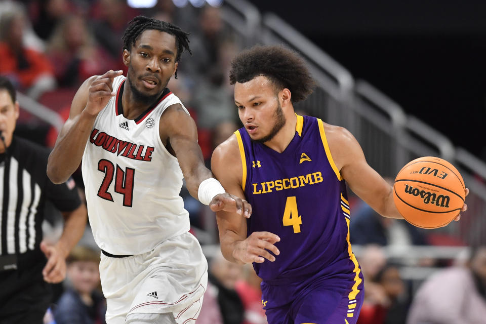 Louisville forward Jae'Lyn Withers (24) attempts to get the ball away from Lipscomb guard Derrin Boyd (4) during the first half of an NCAA college basketball game in Louisville, Ky., Tuesday, Dec. 20, 2022. (AP Photo/Timothy D. Easley)