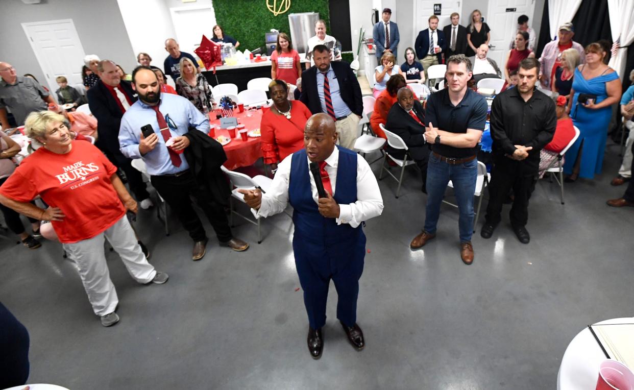 Pastor Mark Burns talks to supporters conceding after results were announced for the U.S. House of Representatives District 3 seat, at his party in Easley, S.C. Tuesday, June 25, 2024.