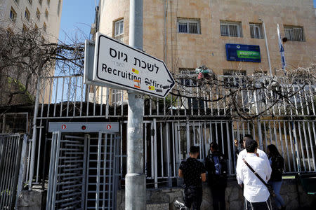 Israelis stand in line at the entrance to the Israeli military recruiting office in Jerusalem, March 13, 2018. REUTERS/Ronen Zvulun