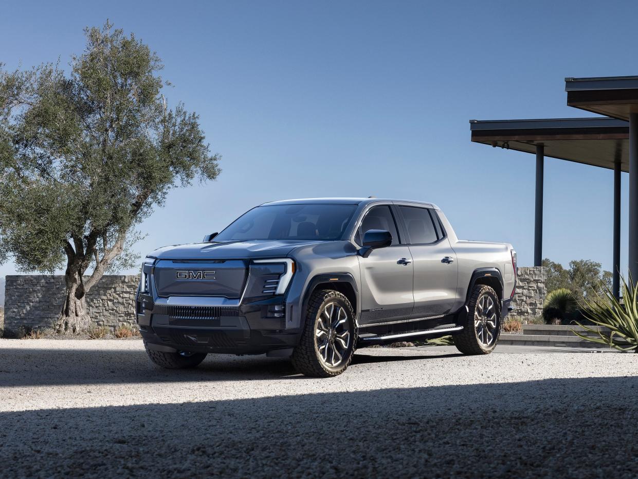 The first-ever GMC Sierra EV Denali Edition 1 from a front 3/4 view.