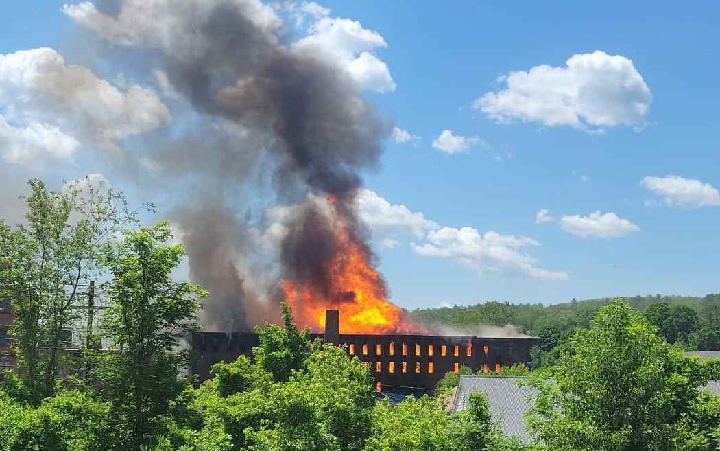A former cereal factory in Orange engulfed in flames Saturday.