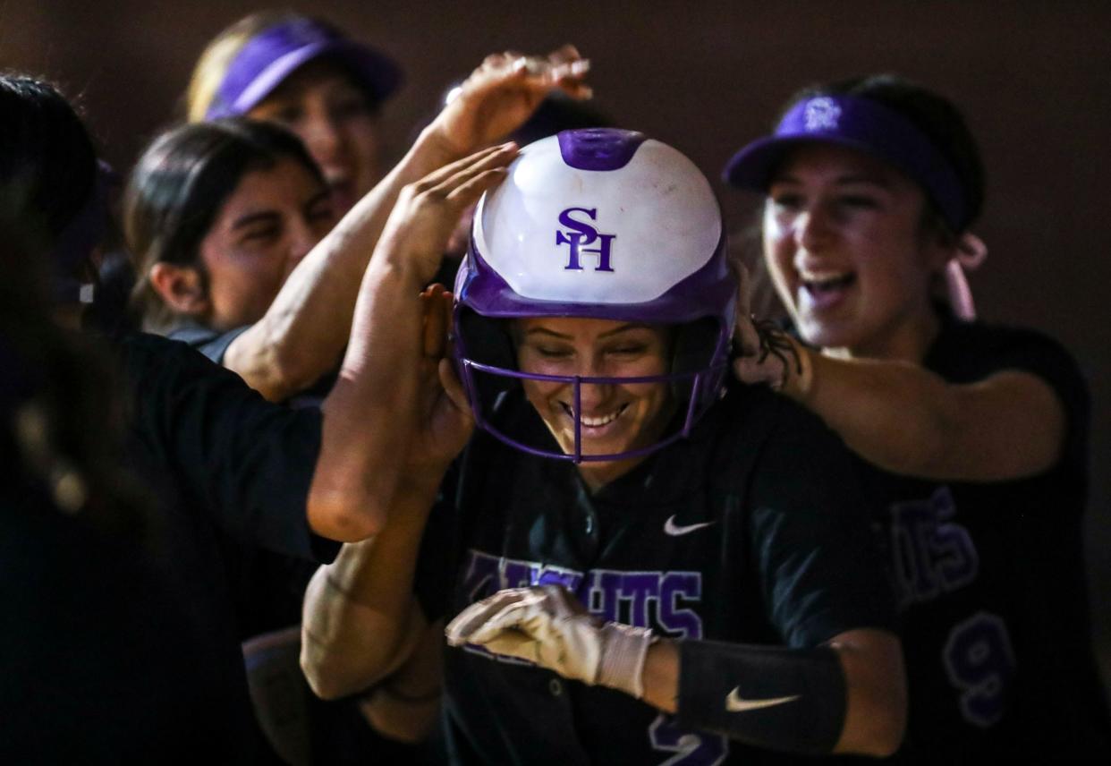 Shadow Hills' Adiana Lujan (2) celebrates a run upon returning to the dugout with her teammates during their first-round playoff game at Shadow Hills High School in Indio, Calif., Thursday, May 5, 2022. 