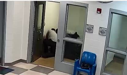 This still image from a security camera provided by Sedgwick County shows Cedric "CJ" Lofton struggling with staff on Sept. 24, 2021 at the Sedgwick County Juvenile Intake and Assessment Center in Wichita, Kan. Sedgwick County released 18 video clips late Friday, Jan. 21, 2022, of what happened before Lofton was rushed to a hospital on Sept. 24. He died two days later. (Sedgwick County via AP)