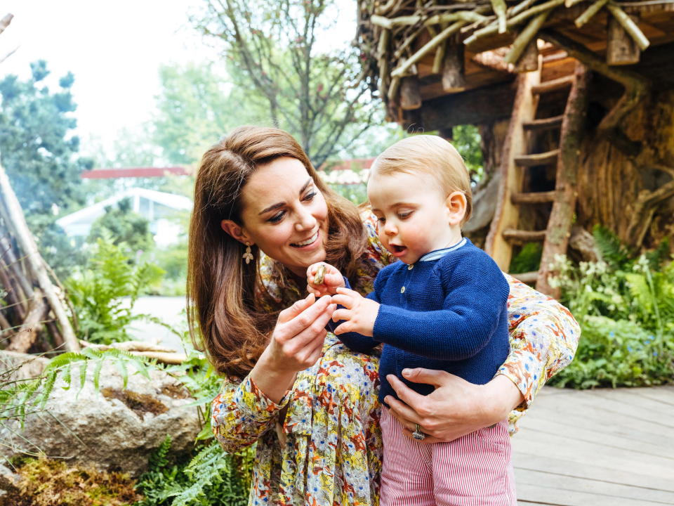 Duchess of Cambridge with Prince Louis in the Adam White and Andree Davies co-designed 'Back to Nature' garden ahead of the RHS Chelsea Flower Show in London, Britain