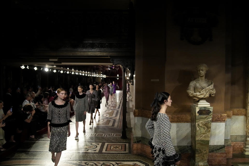 Models wear creations for the Chanel Haute Couture Fall-Winter 2024-2025 collection presented Tuesday, June 25, 2024 in Paris. (AP Photo/Christophe Ena)