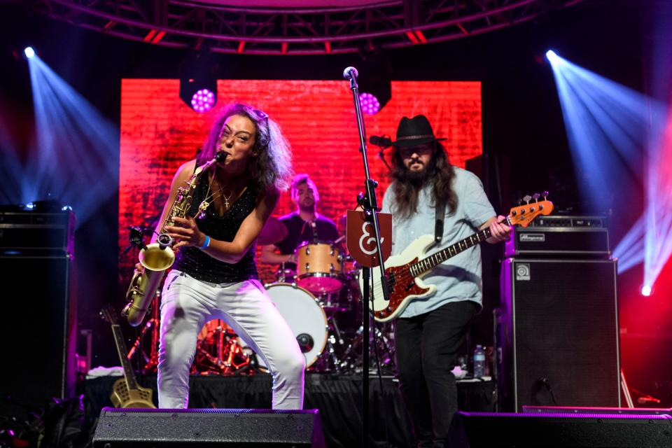 Vanessa Collier, left, plays saxophone alongside bass player CC Ellis, right, during the first night of the W.C. Handy Blues & Barbecue Festival at Audubon Mill Park in Henderson, Ky., Wednesday, June 12, 2019. Collier was named the Blues Foundation's 2019 Horn Player of the Year. 