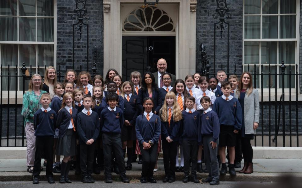 Akshata Murty, wife of Prime Minister Rishi Sunak, greets schoolchildren at Downing Street as part of events to involve schools in the 80th anniversary of D-Day