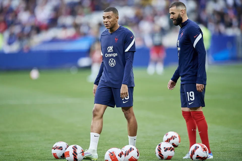 Karim Benzema (Real Madrid) and Kylian Mbappe (Paris Saint-Germain) of France during the warm-up before the UEFA Nations League League A Group 1 match between France and Denmark at Stade de France on June 3, 2022 in Paris, France. (Photo by Jose Breton/Pics Action/NurPhoto via Getty Images)