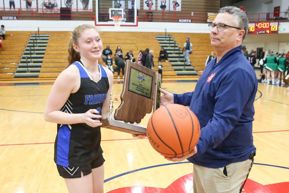 Franklin Community Kennedy Urban (3) receives their trophy following their victoryover Evansville North High School in the Girls Class 4A IHSAA Region 8 basketball championship, Feb 10, 2024; Bedford, IN, USA; at Bedford North Lawrence High School.