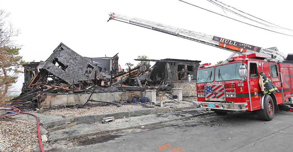 Remains of a Hull home on Q Street after a late Monday afternoon fire pictured Tuesday, May 16, 2023.