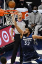 Minnesota Timberwolves' Karl-Anthony Towns (32) lays up a shot in the first half of an NBA basketball game against the Memphis Grizzlies, Wednesday, Jan. 13, 2021, in Minneapolis. (AP Photo/Jim Mone)