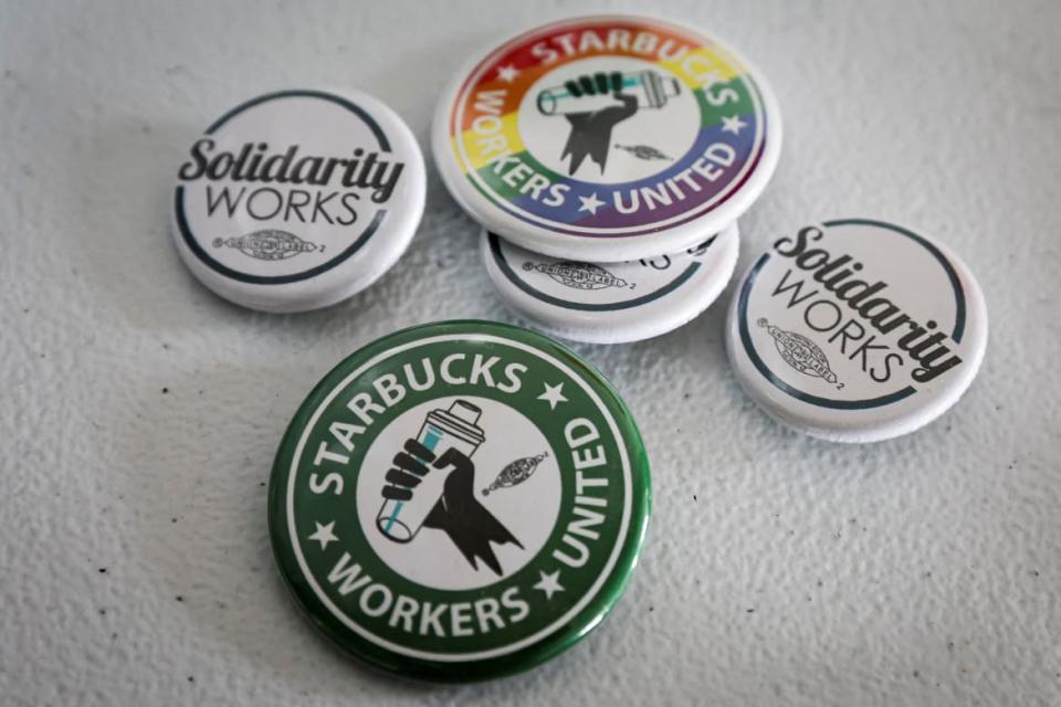 <div class="inline-image__caption"><p>Buttons showing support for a Starbucks Union are seen at the Workers United, an affiliate of the Service Employees International Union, offices in Buffalo, New York.</p></div> <div class="inline-image__credit">Brendan Mcdermid</div>