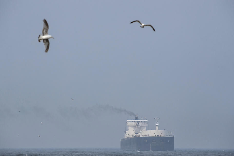 Smoky air over Grand Haven, Mo., as the John J. Boland, a diesel-powered freighter, leaves port on Tuesday, June 27, 2023. The National Weather Service has issued air quality alerts for all of Michigan, effective until tomorrow morning, due to the smoke from Canadian wildfires. (Cory Morse/MLive.com/The Grand Rapids Press via AP)