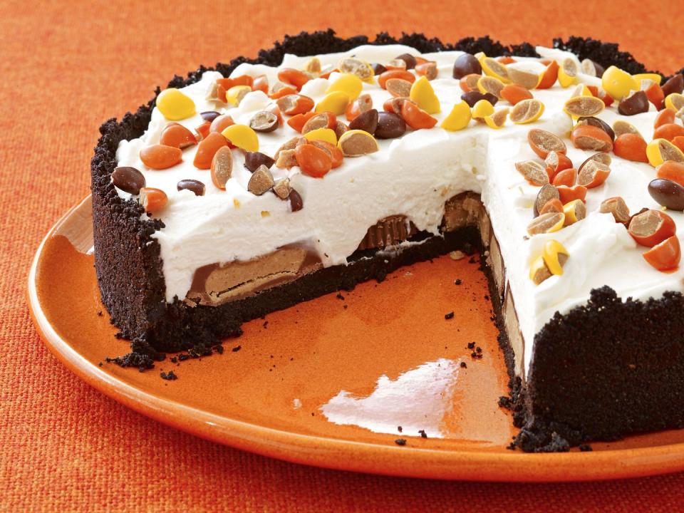 <p>Perfect for peanut butter and cheesecake lovers alike, this no-bake dessert contains a hidden layer of Reese's cups and is topped with Reese's pieces.</p><p><em><a href="https://www.womansday.com/food-recipes/food-drinks/recipes/a12933/no-bake-peanut-butter-cheesecake-recipe-wdy1014/" rel="nofollow noopener" target="_blank" data-ylk="slk:Get the recipe for No-Bake Peanut Butter Cheesecake;elm:context_link;itc:0;sec:content-canvas" class="link ">Get the recipe for No-Bake Peanut Butter Cheesecake</a>.</em></p>