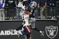 Las Vegas Raiders wide receiver Keelan Cole (84) catches a 30-yard touchdown pass against New England Patriots cornerback Marcus Jones (25) during the second half of an NFL football game between the New England Patriots and Las Vegas Raiders, Sunday, Dec. 18, 2022, in Las Vegas. (AP Photo/John Locher)