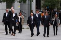 FILE PHOTO: Dismissed Catalan Foreign Affairs chief Raul Romeva waves as he arrives to Spain's High Court after being summoned to testify on charges of rebellion, sedition and misuse of public funds in Madrid