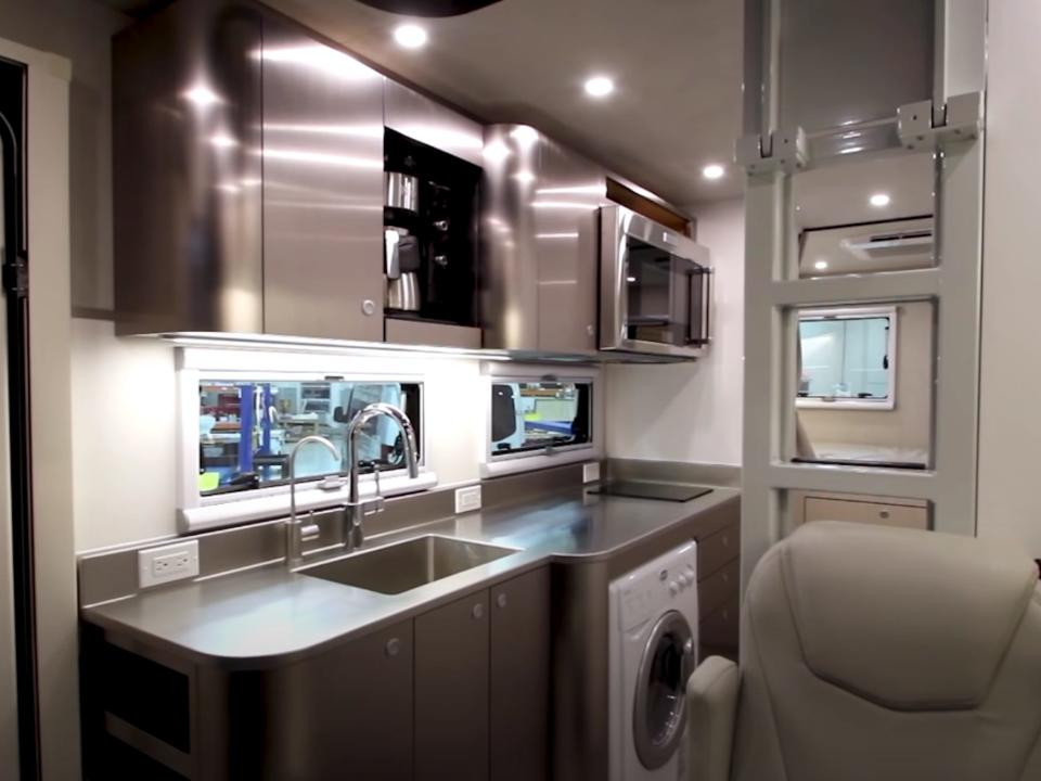 The kitchen Asteroid of Happiness B Box RV with a seat in front of the area