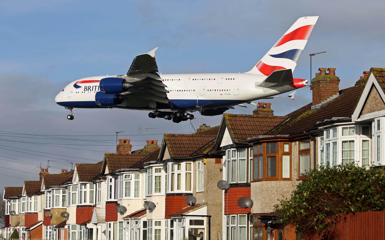 A British Airways Airbus A380 plane lands over houses in Myrtle Avenue near Heathrow Airport, - Steve Parsons/PA 
