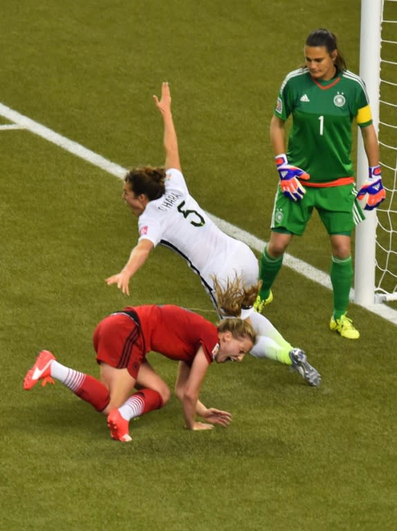 USA's defender Kelley O'Hara (C) celebrates her score against Germany during the Women's World Cup semi-finals at Olympic Stadium in Montreal on June 30, 2015