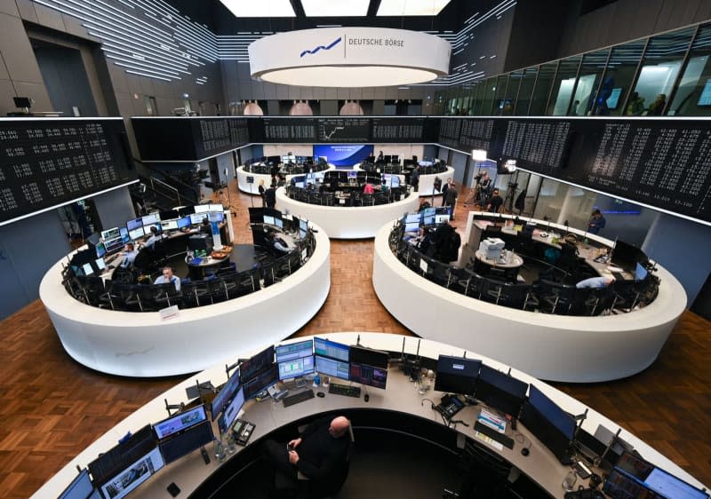 Stock traders from various companies work in five circular and one semi-circular trading floor at the Frankfurt Stock Exchange. Arne Dedert/dpa