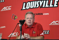 FILE - In this Aug. 11, 2018, file photo, then-University of Louisville head football coach Bobby Petrino speaks to reporters during Louisville Football Media Day, in Louisville, Ky. Petrino, a coach with a track record of on-the-field success but off-the-field embarrassments, will be the next coach at Missouri State, the university said Wednesday, Jan. 15, 2020. (AP Photo/Timothy D. Easley, File)