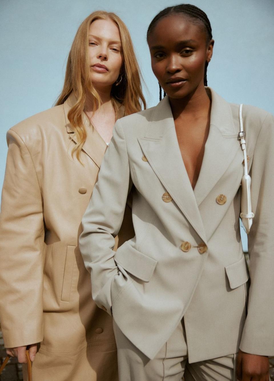 hurr rental flex featuring two models wearing beige suits