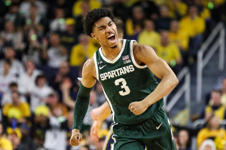 Michigan State guard Jaden Akins (3) celebrates a play against Michigan during the first half at Crisler Center in Ann Arbor on Saturday, Feb. 18, 2023.