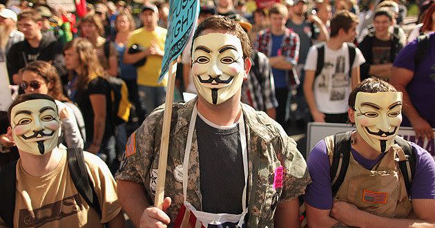 Inspired by the leaderless Occupy Wall Street movement, U.S. veterans who did not want to give their names, don Guy Fawkes masks while demonstrating in front of the U.S. Chamber of Commerce October 6, 2011. Source: Getty