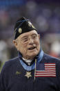 FILE - Woody Williams, 94, the only living Marine Medal of Honor recipient from World War II, gets ready to assist with the coin toss, before the NFL Super Bowl 52 football game between the Philadelphia Eagles and the New England Patriots, Sunday, Feb. 4, 2018, in Minneapolis. Williams, the last remaining Medal of Honor recipient from World War II, died Wednesday, June 29, 2022. He was 98. Williams' foundation announced on Twitter and Facebook that he died at the Veterans Affairs medical center bearing his name in Huntington. (AP Photo/Tony Gutierrez, File)