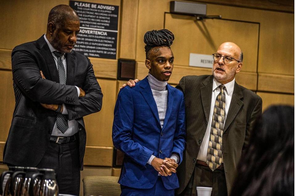 Defense lawyers David Howard (far left) and Stuart Adelstein flank their client Florida rapper Jamell Maurice Demons known as YNW Melly, who is accused of killing two friends in October 2018, on Wednesday, April 12, 2023, in Fort Lauderdale.