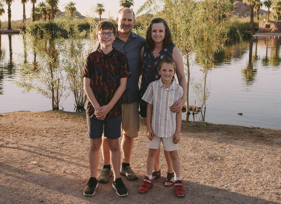This photo provided by Samantha Rose Photography LLC shows North Dakota Sen. Doug Larsen, second from left, with his wife, Amy, and their two sons, Christian and Everett, on Saturday, Sept. 29, 2023, at Papago Park in Phoenix, Ariz. All four of them died the following day, Sunday, Sept. 30, in a plane crash near Moab, Utah. (Samantha Brammer/Samantha Rose Photography LLC via AP)