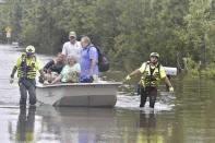 CORRECTS DATE TO SEPT. 17 NOT AUG. 17 Members of a citizen response team from Indiana assist in high water rescue of residents, Thursday, Sept. 17, 2020 in Pensacola, Fla. Homeowners and businesses along the soggy Gulf Coast have begun cleaning up in the wake of Hurricane Sally, even as the region braces for a delayed, second round of flooding in the coming days from rivers and creeks swollen by the storm's heavy rains. (Tony Giberson/Pensacola News Journal via AP)