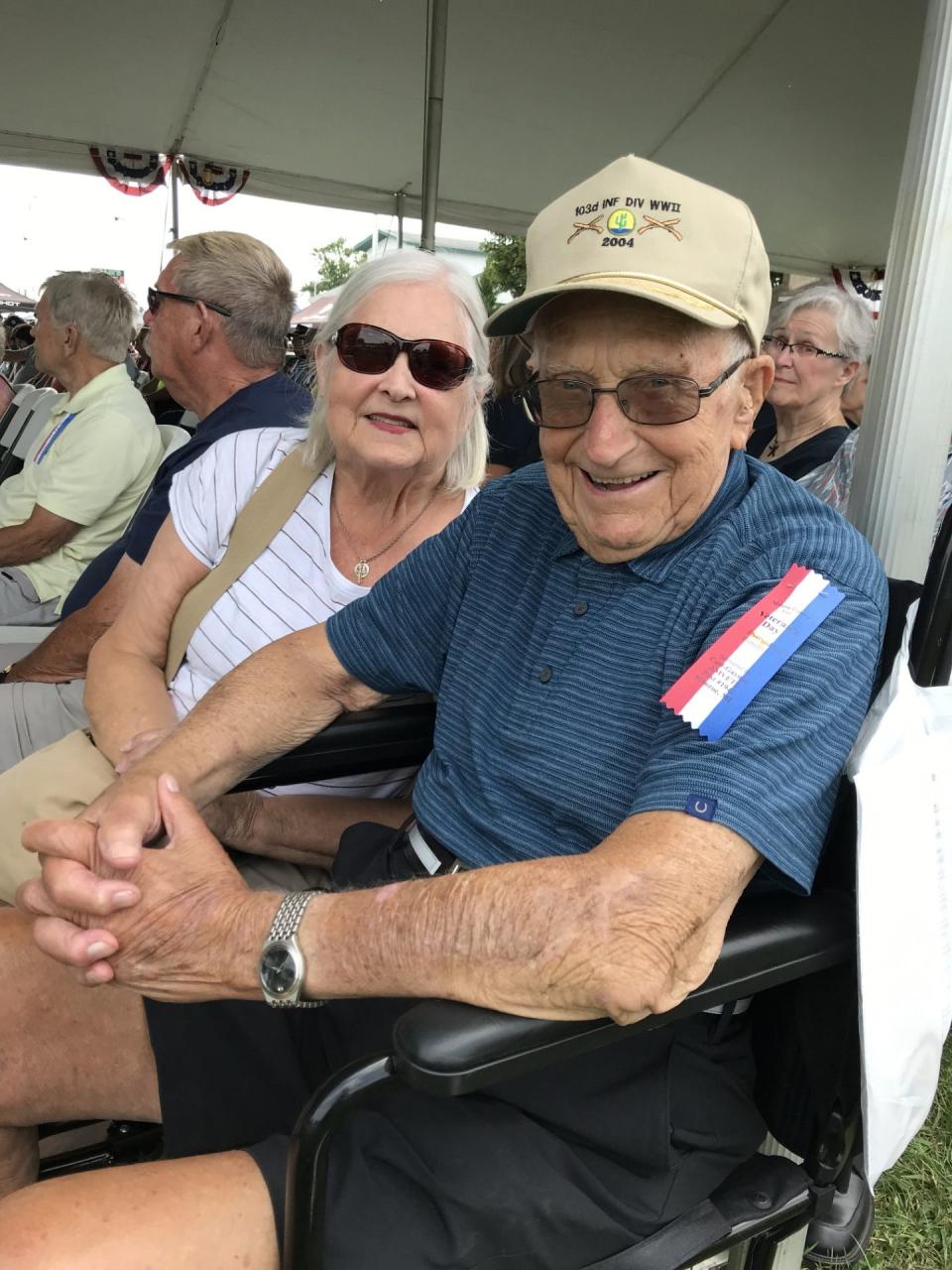 Eugene Poupard, 101, of Monroe was honored as the oldest veteran present at Monday's Veterans Day program at the Monroe County Fair. Poupard is shown with his daughter, Mickey Smith.