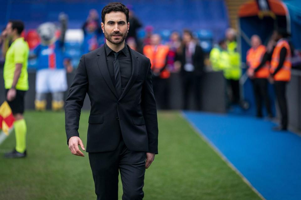 brett goldstein, playing roy kent, walks along the touchline of the football pitch in a season 2 episode of ted lasso