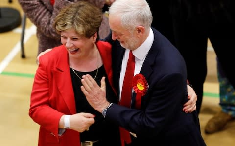 Jeremy Corbyn tries to high five Shadow Foreign Secretary Emily Thornberry - Credit: Reuters