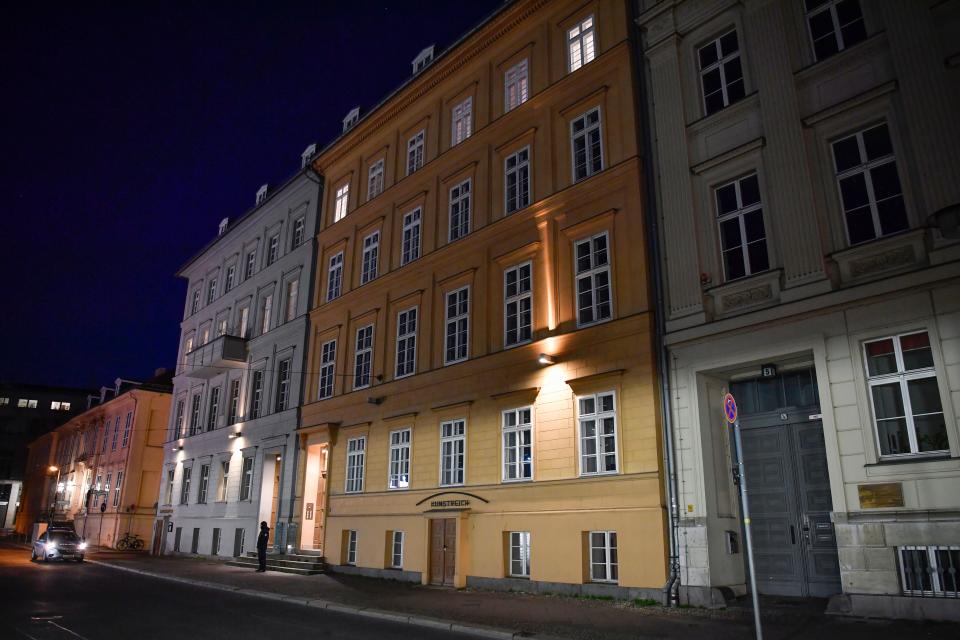 A Police officer stands guard outside a house where German Chancellor Angela Merkel has an apartment with her husband in Berlin on March 22, 2020 after it was announded by her spokesman that Merkel is going in to quarantine after being treated by a doctor who has since tested positive for the novel coronavirus COVID-19. (Photo by John MACDOUGALL / AFP) (Photo by JOHN MACDOUGALL/AFP via Getty Images)