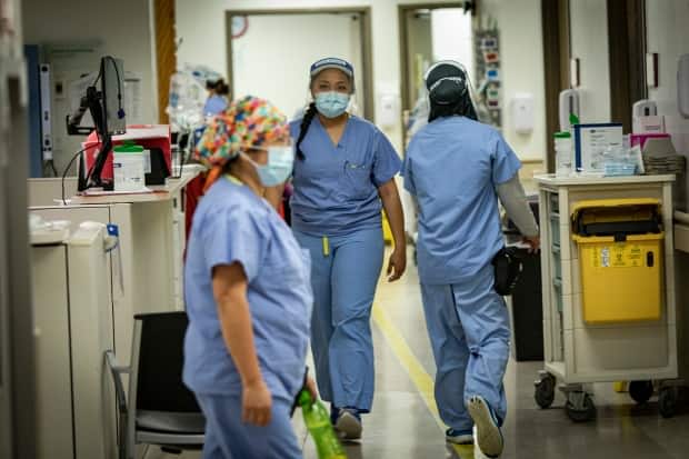 Nurses move through the halls of the emergency department at Scarborough General Hospital earlier this month. (Evan Mitsui/CBC - image credit)
